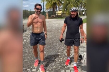 Everton Ribeiro e Bell Marques caminhando juntos em fazenda