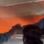 Passageiros tentam conter fogo no bagageiro de um avião