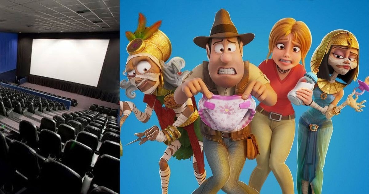 Interior de sala de cinema vazia com poltronas vermelhas